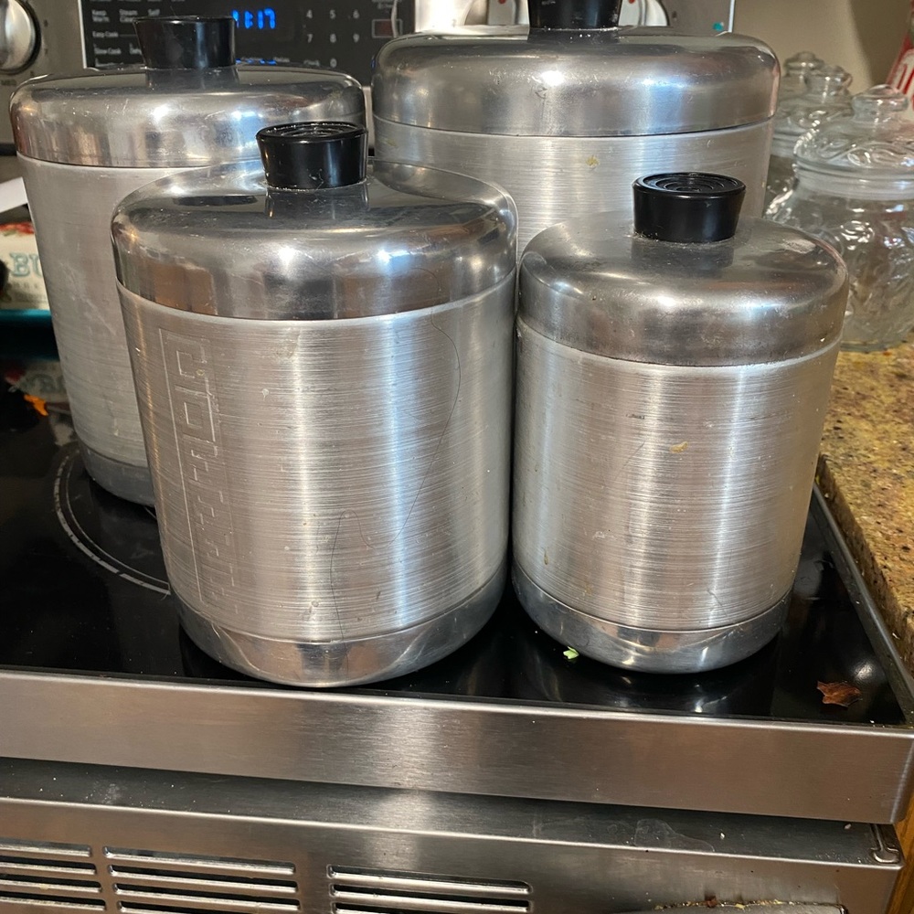 Sleek  vintage Silver Canister Set with Black Lids